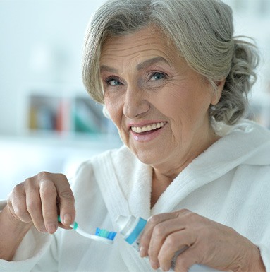 Dentures patient in Soldotna cleaning their dentures